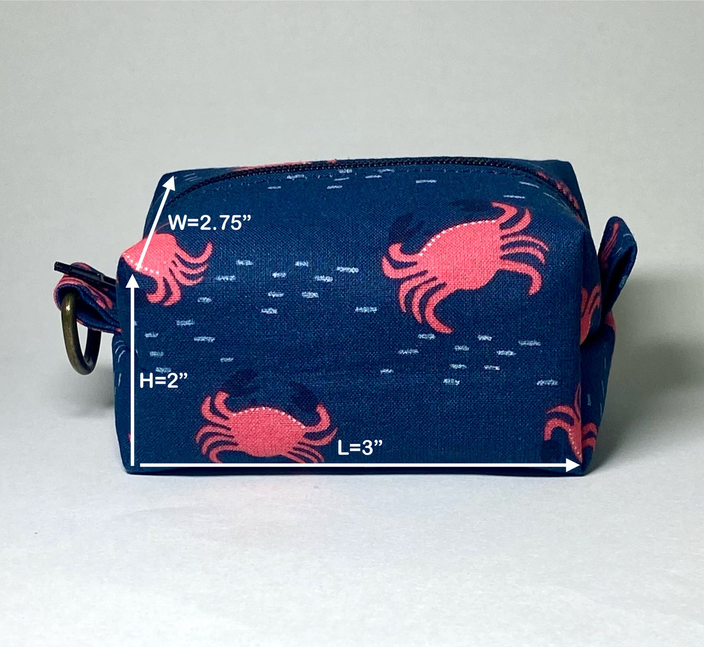 Pouch with red crab patterns on a navy background